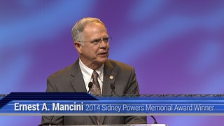 Ernest A. Mancini receives the 2014 Sidney Powers Award