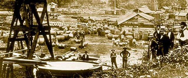 Two early oil wells, located in Pennsylvania in the mid-19th century. Notice the many different sized barrels in the background. At this time, barrel size was not yet standardized, which made sayings like, 